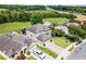 Gorgeous aerial view of property featuring mature landscaping, lush lawns, and convenient access to the highway at 2411 Sabastian St, Mount Dora, FL 32757