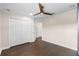 The bedroom features a ceiling fan, closet space, hardwood flooring, and easy access to other rooms at 2411 Sabastian St, Mount Dora, FL 32757
