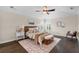 Comfortable bedroom with ceiling fan, a plush bed, and stylish decor at 2411 Sabastian St, Mount Dora, FL 32757