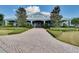 Beautiful blue clubhouse with a metal roof and a brick path leading to the entrance at 2411 Sabastian St, Mount Dora, FL 32757