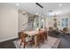 Bright dining room featuring hardwood floors, neutral paint, plantation shutters, and modern chandelier at 2411 Sabastian St, Mount Dora, FL 32757