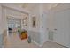 Spacious foyer with tiled flooring and high ceilings leads into a bright living area at 25057 Riverwalk Dr, Leesburg, FL 34748