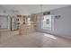 Spacious eat-in kitchen boasting bar-stool seating, stainless steel appliances, and light wood cabinetry at 25057 Riverwalk Dr, Leesburg, FL 34748