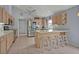 Spacious kitchen featuring stainless appliances, breakfast bar, and ample cabinet space at 25057 Riverwalk Dr, Leesburg, FL 34748