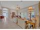 Open-concept home featuring living, dining, and sitting areas with natural light at 25057 Riverwalk Dr, Leesburg, FL 34748