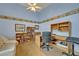 Inviting office space with built-in bookshelves, desk, and comfortable seating, perfect for a home office at 25057 Riverwalk Dr, Leesburg, FL 34748