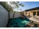 Backyard featuring a playset with slides, swings and a covered patio with outdoor seating at 2790 Monticello Way, Kissimmee, FL 34741