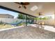 Covered backyard with a patio set, hammock, and a play area, perfect for relaxation and entertainment at 2790 Monticello Way, Kissimmee, FL 34741