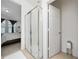 Shower room featuring a walk-in shower and views into main bedroom at 2790 Monticello Way, Kissimmee, FL 34741