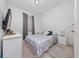 Cozy bedroom offers simple décor with a bed, dresser, and soft lighting at 2790 Monticello Way, Kissimmee, FL 34741