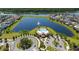This aerial showcases the community pool area with a large pool and lake at 2790 Monticello Way, Kissimmee, FL 34741