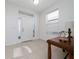 Bright entryway featuring tile flooring, decorative glass door accents, and natural light at 2790 Monticello Way, Kissimmee, FL 34741