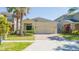 Charming one-story home with a two-car garage, brick driveway, and well-maintained landscaping at 2790 Monticello Way, Kissimmee, FL 34741