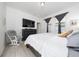 Well-lit main bedroom features wood floors, a large TV, and views through the windows at 2790 Monticello Way, Kissimmee, FL 34741