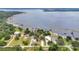 Aerial shot showcasing lakefront homes with private docks surrounded by scenic views and lush landscaping at 3085 Vest Rd, St Cloud, FL 34772