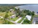 An aerial view of waterfront homes with well-manicured lawns leading to the lake and private docks at 3085 Vest Rd, St Cloud, FL 34772