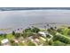An aerial view of waterfront properties with scenic lake views and docks, surrounded by natural beauty at 3085 Vest Rd, St Cloud, FL 34772
