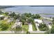 An aerial view of waterfront homes along a lake with lush green lawns and private docks at 3085 Vest Rd, St Cloud, FL 34772