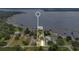 Aerial view of lakefront property with mature trees, private dock, and proximity to waterways at 3085 Vest Rd, St Cloud, FL 34772