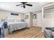 Comfortable bedroom with wood-look flooring and calming neutral decor at 3085 Vest Rd, St Cloud, FL 34772