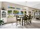 Bright dining area with large windows offering scenic views of the lake at 3085 Vest Rd, St Cloud, FL 34772