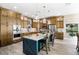 Gourmet kitchen featuring custom cabinets, a center island, and stainless steel appliances at 3085 Vest Rd, St Cloud, FL 34772