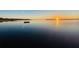 Beautiful view of sunrise reflecting on calm lake at 3085 Vest Rd, St Cloud, FL 34772