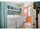 Bright laundry room features modern appliances, ample storage, and cheerful decor for an efficient workspace at 3085 Vest Rd, St Cloud, FL 34772
