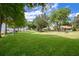 A large and well-manicured lawn leading to the lake and dock at 3085 Vest Rd, St Cloud, FL 34772
