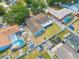 Aerial view of property highlighting the backyard, neighboring homes, and lush green landscape at 329 Drake Elm Dr, Kissimmee, FL 34743