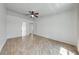 Spacious bedroom featuring wood-look flooring and a ceiling fan, offering plenty of natural light at 329 Drake Elm Dr, Kissimmee, FL 34743