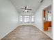 Charming dining area featuring wood-look floors, a ceiling fan, and a large bay window at 329 Drake Elm Dr, Kissimmee, FL 34743