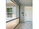 Inviting front porch area with a tiled floor, perfect for relaxing outdoors at 329 Drake Elm Dr, Kissimmee, FL 34743