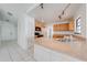 Open kitchen layout with tiled floors and breakfast bar area at 329 Drake Elm Dr, Kissimmee, FL 34743