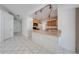 Kitchen and dining area with tile floors and modern track lighting at 329 Drake Elm Dr, Kissimmee, FL 34743