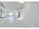 Spacious open living area with vaulted ceilings and white tile flooring at 329 Drake Elm Dr, Kissimmee, FL 34743