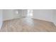 Open living area featuring modern wood-look floors, neutral colors, and ample natural light at 329 Drake Elm Dr, Kissimmee, FL 34743