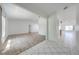 Bright, open-concept living area with neutral paint, modern tile, and wood-look flooring at 329 Drake Elm Dr, Kissimmee, FL 34743