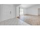 Inviting living area featuring light-colored walls and updated wood-look flooring at 329 Drake Elm Dr, Kissimmee, FL 34743