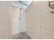 Tiled walk-in shower featuring a modern shower head and a built-in soap dish at 329 Drake Elm Dr, Kissimmee, FL 34743