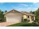 Charming single-story home featuring a two-car garage, brick walkway, and well-manicured lawn at 3337 Rolling Plains Cir, Clermont, FL 34714