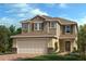 Charming two-story home features a brick-accented facade, a two-car garage, and a manicured lawn at 3389 Rolling Plains Cir, Clermont, FL 34714