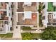 Aerial of the rooftops reveals private outdoor spaces with hot tubs and rooftop terraces at 356 S Osceola Ave # 19, Orlando, FL 32801