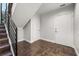 Basement area featuring tile flooring, white walls, and a staircase at 356 S Osceola Ave # 19, Orlando, FL 32801