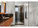 Modern bathroom featuring a glass shower with pebble floor and granite vanity at 356 S Osceola Ave # 19, Orlando, FL 32801