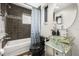 Stylish bathroom with modern fixtures, a glass sink, and a luxurious soaking tub at 356 S Osceola Ave # 19, Orlando, FL 32801
