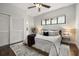 Bright bedroom with a large window, stylish furniture, and a cozy bed with a purple blanket at 356 S Osceola Ave # 19, Orlando, FL 32801