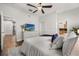 Serene bedroom with a TV, cozy bedding, and ample closet space at 356 S Osceola Ave # 19, Orlando, FL 32801
