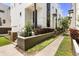 Street view of townhomes with clean, modern architecture and manicured landscaping at 356 S Osceola Ave # 19, Orlando, FL 32801