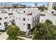 Modern multi-level townhouse showcasing sleek lines and rooftop terraces in a vibrant urban setting at 356 S Osceola Ave # 19, Orlando, FL 32801